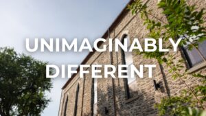 Exterior of the Roe at Manayunk Bell Collection building with the words unimaginably different on top of the photo