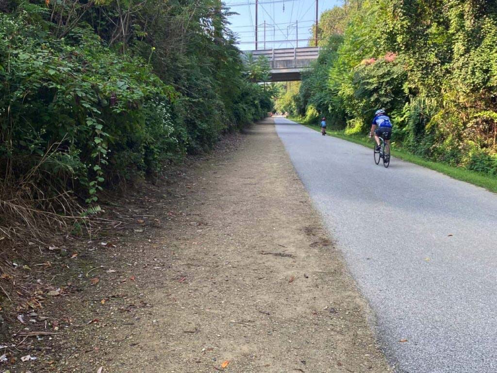 Bicyclists riding on a paved path